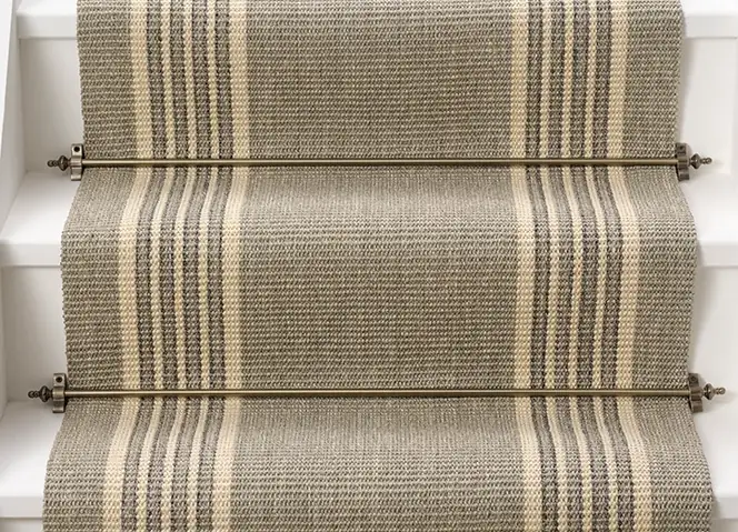 close-up of an oatmeal-colored sisal stair runner with a classic herringbone weave.