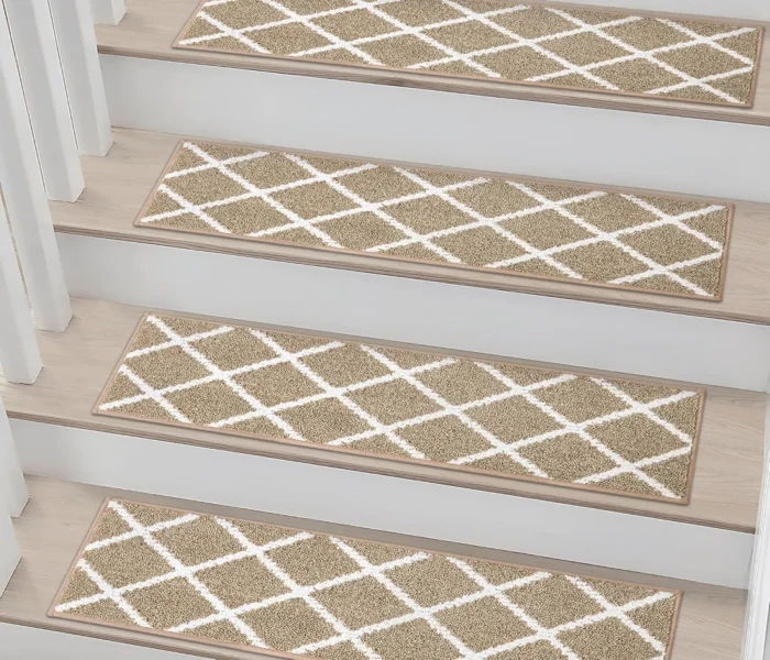 non-slip carpet stair treads featuring a beige and white Moroccan trellis pattern on light-colored wooden stairs with white risers.