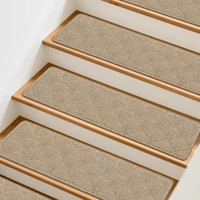 polyester stair treads featuring a diamond-quilted pattern, neatly installed on light wood and white-painted indoor stairs.