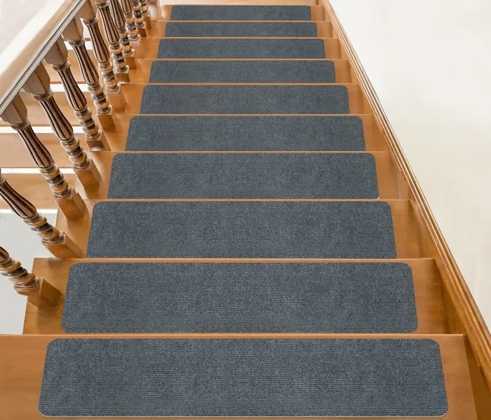 rectangular non-slip carpet treads centered on each step to provide traction and safety.