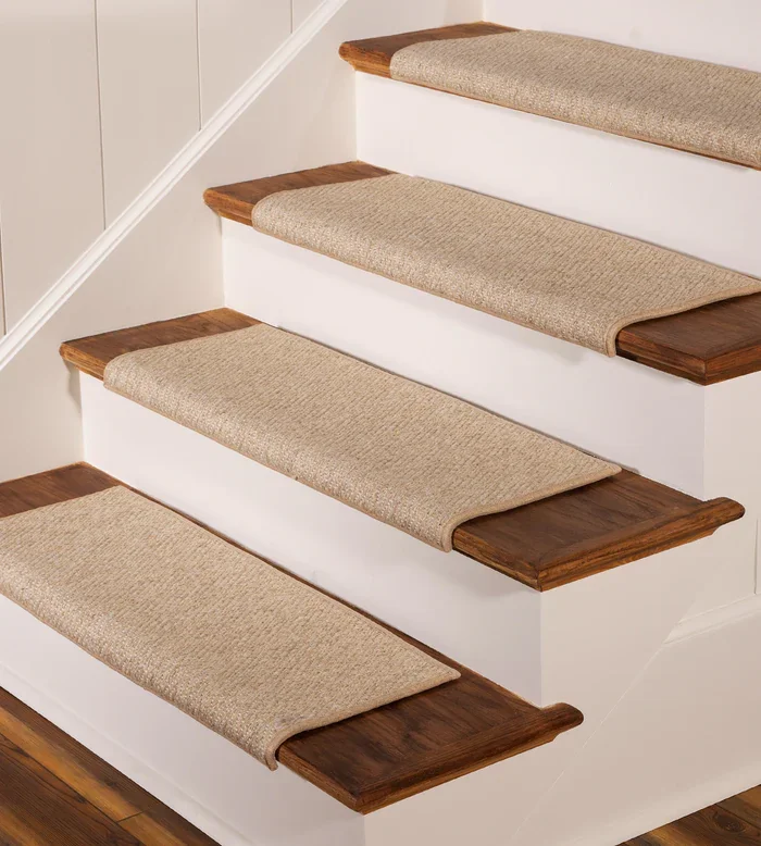 wool stair carpet treads featuring a grey and white herringbone pattern, designed with a non-slip backing for safety on wooden steps.