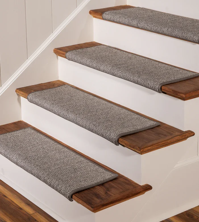 wool stair tread installed on a wooden staircase, showcasing the soft texture and protective coverage.
