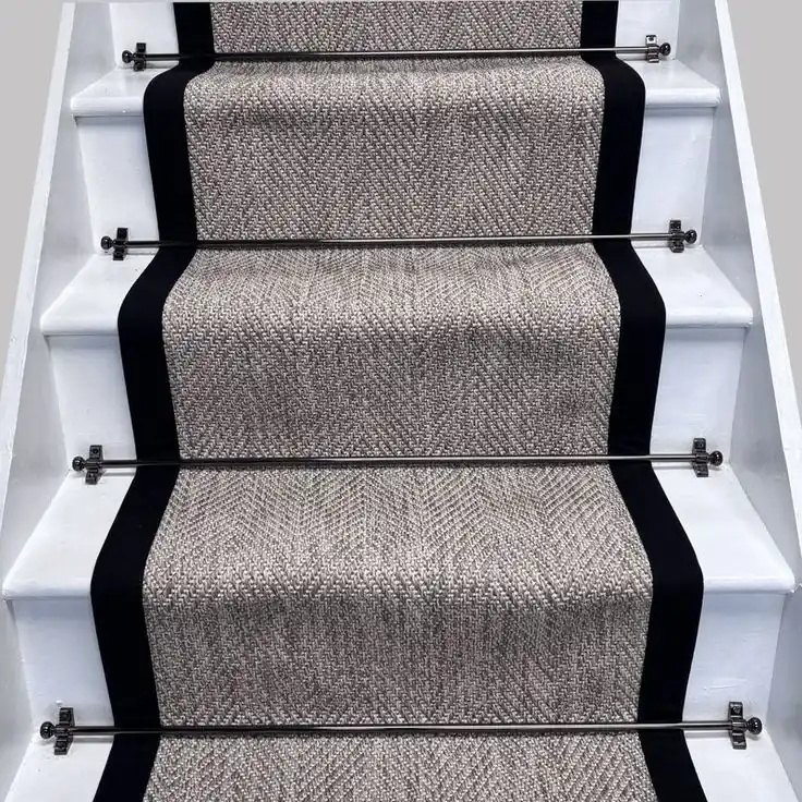 stair carpet runner with black border on white staircase