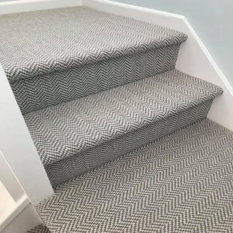 Grey Textured Stair Carpet featuring a thick loop chevron pattern on fully carpeted steps.