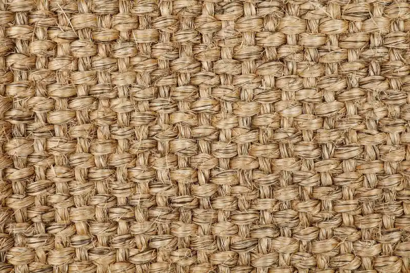 Natural coarse-textured sisal woven material with a robust interlocking weave pattern for Sisal Stair Runners Dubai.
